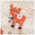 Close-up of wooden orange Christmas reindeer ornament with striped legs and a scarf - Orange