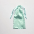 Light green silk satin drawstring bag with elegant ribbon closure for jewelry storage - Elegant Green