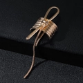 Elegant gold metal bow hair clip with long snake chain tassels on black leather surface - Gold (B8131)