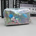 Borsa cosmetica olografica blu con glitter liquidi e pompon colorati vivaci - Borsa Trucco Blu