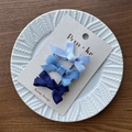Set of three blue gradient ribbon bow hair clips on a white display plate - Blue Series