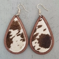 Detail of wooden teardrop earrings featuring brown and white cow hair leather inlays - Dark Wood/Brown White Cow Print