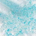 Macro view of blue spotted glass beads spilling from clear tubes for DIY jewelry - 8mm Spotted Beads / Blue