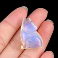 Mini hand-carved opalite wolf gemstone figurine with iridescent white finish - Opal (Synthetic)