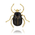 Golden beetle brooch featuring polished black enamel shell on a white background - Shiny Black Polished Gold Leg Beetle