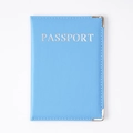 Light blue PU leather passport holder with silver lettering and metal corners - Sky Blue