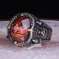 Macro shot of vintage men's ring with amber stone and intricate Arabic engravings - Amber Gemstone Arabic Relief(KJZ045XS)