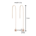 Elegant rose gold threader earrings with shiny cubic zirconia flower charms, 11cm length - NE1055 Snowflake