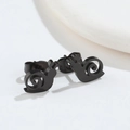 Macro detail of minimalist black snail stud earrings in matte finish stainless steel - 512 Black (Snail)