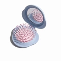 Portable blue folding hairbrush with integrated mirror and pink bristle base for travel - Blue Cloud Folding Hairbrush