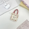 Mini oortelefoontasje met bloemenprint, sozakka-logo en rode handvatten met haak - Rood