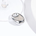 Macro view of a smooth silver oval drop pendant with a small hole for DIY jewelry making - Silver Large Pebble (30*20MM)