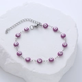 Close-up of purple evil eye enamel beads with adjustable stainless steel chain and clasp - Purple