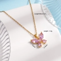 Golden titanium steel butterfly necklace with pink zirconia gems on white prop - Pink