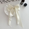 Elegant white satin butterfly hair clip with smooth glossy finish on a clean surface - Off-White Large Ribbon Satin Bow Spring Clip / Off White