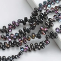 Detailed view of teardrop black glass crystal beads with rainbow electroplated finish - 100 Pcs/Pack / Half Gun Black Purple