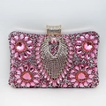 Detailed view of pink and silver rhinestone floral patterns on a luxury evening clutch bag - Pink