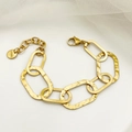 Macro view of 18K gold plated stainless steel bracelet with hammered texture links - Hammered Oval Chain