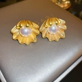 Elegant gold shell stud earrings with vintage purple pearls on grey leather display - 39# Gold Pearl Shell