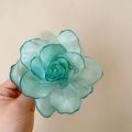 Detail view of a teal gradient fabric rose hair clip with layered organza petals. - Duckbill Hair Clips / Cyan
