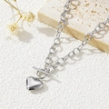 Collana a catena in acciaio argento con ciondolo a cuore e chiusura OT su pietra - Collana con chiusura a T / Color Acciaio