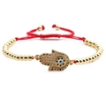 Hamsa hand bracelet with red cord, gold beads, and colorful zircon devil's eye charm - Copper Beads Red Rope