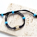 Handcrafted black braided bracelet featuring five light blue beads and golden oval clasp - Black Woven Rope Blue Beads Bracelet