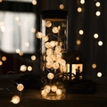 Warm white LED crackle ball string lights glowing inside a glass jar for festive decor - 2m Crackle Bead Warm White Battery Style