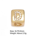 Macro shot of 8mm gold letter D charm bead with inlaid white zircon for DIY jewelry - Letter D