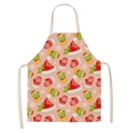Detail of pink Christmas apron featuring festive Santa hats and colorful winter mittens - Style-20 (Pink Xmas Hat)