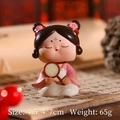 Pink Hanfu Tang Dynasty lady figurine sitting on an ancient book, size 4.5x4x7cm - 2C Fanning - Large Shaking Head Ornament