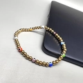 Elastic 18K gold-plated steel bead bracelet featuring colorful multi-colored evil eye charms - Mixed Color Eye - Gold