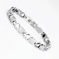 Detailed close-up of a stainless steel heart-shaped magnetic therapy bracelet with fold-over clasp - Silver