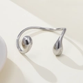 Detailed view of silver stainless steel open bangle with asymmetric water drop ends - Silver Style (JZ-B24602S)