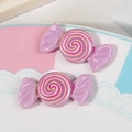 Pair of purple resin candy charms with pink and yellow swirls for DIY hair accessories - Purple