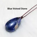 Natural teardrop Sodalite crystal pendant with brown braided cord on white fur - Sodalite Teardrop Pendant