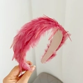 Detailed view of vibrant rose red feather headband with fluffy texture and pink lining - Rose Red Feather Headband