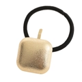 Detailed view of black elastic hair tie with a textured gold square metal ornament - Gold