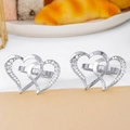 Silver double heart napkin rings with crystal accents on a set table setting - Silver Rhinestone Double Heart