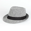 Detailed macro view of the grey textured fabric weave and black satin ribbon on a Fedora hat - Gray