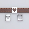 Silver openwork heart slide charms on a brown leather wristband accessory - Heart