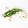 Green crystal resin koi fish statue with gold foil details on white background - Emerald Glaze