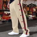 Detail of beige men's trousers with plaid side stripes and red button accents - Khaki