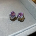 Macro view of silver earrings with purple crystals and pavé stones on grey velvet - 22# Earring - Silver - Purple