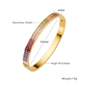 Detailed view of 6mm wide gold stainless steel bangle with colorful square-cut gemstones - Gold Color Bracelet