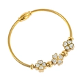 Bracelet trèfle doré avec câble en acier torsadé et ornements en zircons blancs - Fleur à Quatre Pétales