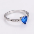 Detailed close-up of a silver heart ring featuring a blue gemstone and white zircon accents - Steel (Blue Zirconia)