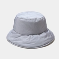 Macro view of light grey down bucket hat showing water-resistant nylon texture and puffiness - M (56-58cm) / Light Blue