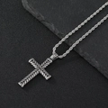 Macro shot of a silver textured cross pendant on a stainless steel twist chain - Rhombus Cross Necklace (Twist Chain)