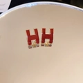 Macro shot of H-shaped red enamel stud earrings with golden metallic edges - Red H Letter (61#)